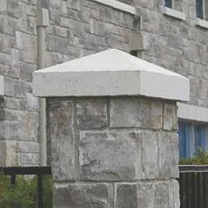 Stone post with cement post cap.