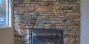Upstairs interior thin stone veneer fireplace display