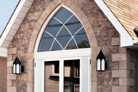 Shouldice Designer Stone - Door with window above and Gothic surround