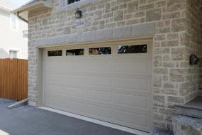 Double garage door with Tudor header and keystone