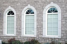 Shouldice Designer Stone - 3 windows with Roman surrounds