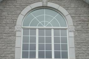 Shouldice Designer Stone - Window with Roman surround and keystone
